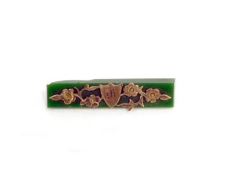 A 9ct gold and jade brooch