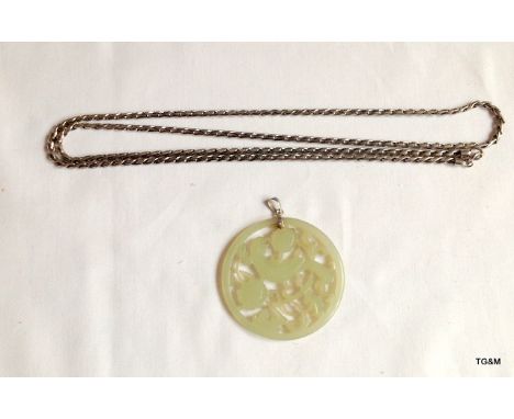 A Chinese jade Roundel on a white metal neck chain