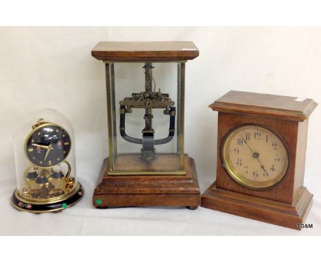 A Bulle Electro clock missing dial in a full glass case, a glass domed small anniversary clock and a mahogany mantle clock