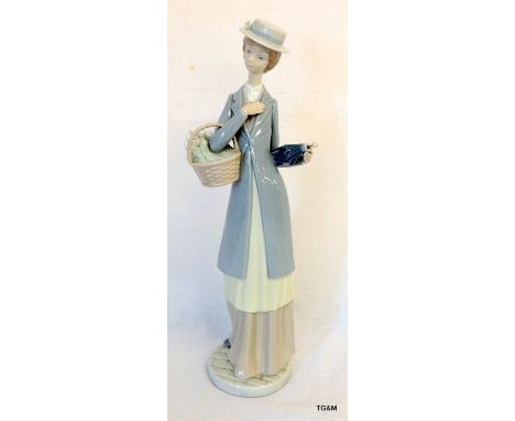 A Nao figure of a lady with an umbrella and flowers 38cm