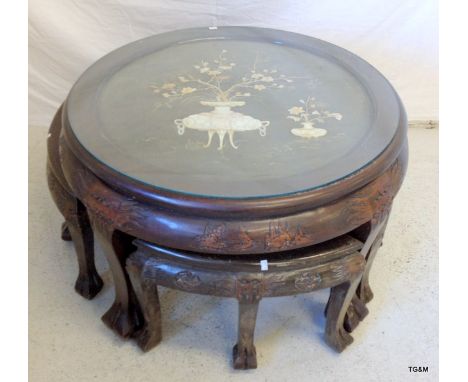 A Chinese round nest of tables with mother of pearl inlay 51 x 75