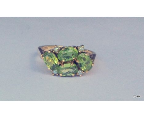 A 9ct gold peridot and pearl ladies ring maker CJ size M