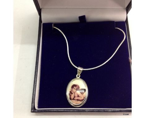 A silver and pictorial enamel set cherub necklace