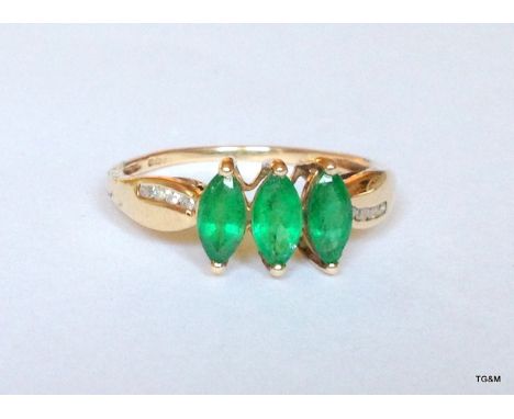 A 9ct gold ring with diamond shoulders, size R