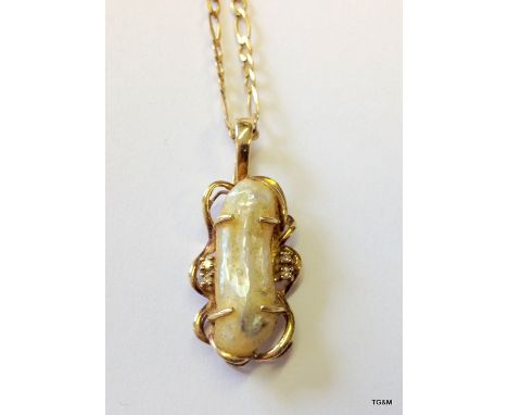 A 9ct gold mother of pearl  and diamond pendant and chain