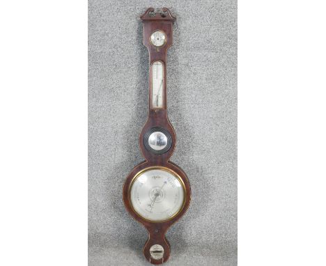 A 19th century mahogany and satinwood inlaid banjo barometer with silvered dials and inset convex mirror. L.100cm (Damaged as