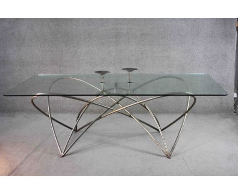 Gerry Judah (B.1951), dining table with plate glass top on bent steel base with integral pricket candle sconces. H.70 W.220 D