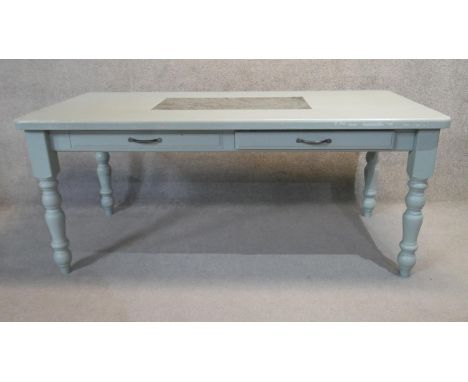 A 19th century style painted kitchen dining table table with inset marble top and frieze drawers on turned tapering supports.