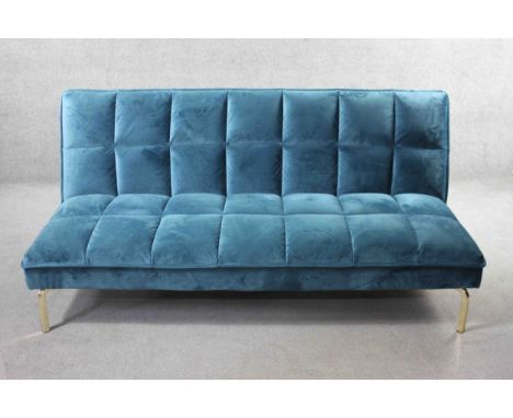 A contemporary futon style sofa bed in velour upholstery on chrome supports. H.80 W.166 D.45 cm. 