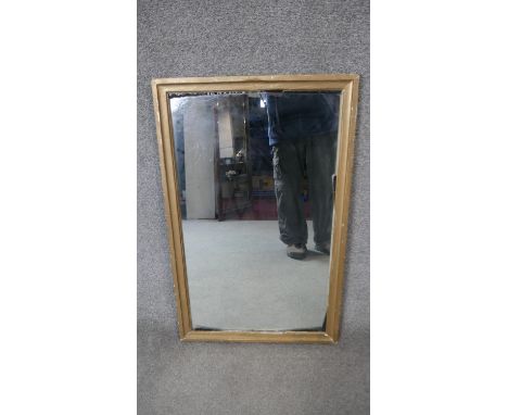 A gilt framed wall mirror. H.122 W.46cm 