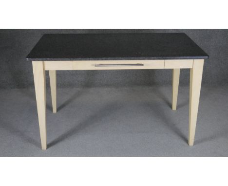 A contemporary marble topped kitchen dining table with frieze drawer on painted base. H.70 W.121 D.69cm 