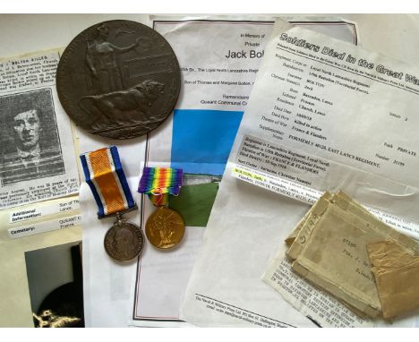 A FIRST WORLD WAR PAIR AND MEMORIAL PLAQUE TO THE LOYAL NORTH LANCASHIRE REGIMENT. A Great War pair comprising War Medal and 