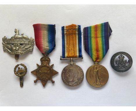 A FIRST WORLD WAR TRIO AND SILVER WAR BADGE TO THE GLOUCESTER REGIMENT. A Great War Trio comprising 1914-15 Star named to 191