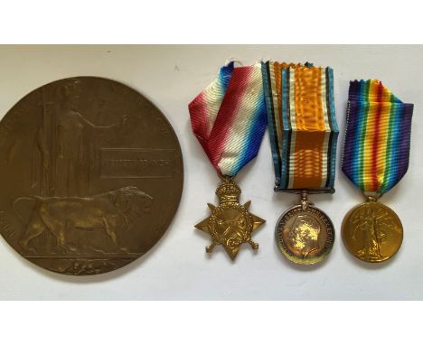 A FIRST WORLD WAR TRIO AND MEMORIAL PLAQUE TO THE SUFFOLK REGIMENT. A Great War Trio comprising 1914-15 Star named to 12985 P