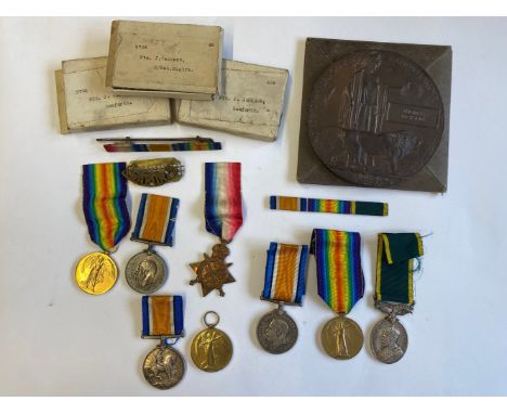 A FAMILY COLLECTION. A family group of First World War Medals and Memorial Plaque comprising: A Great War Trio comprising 191