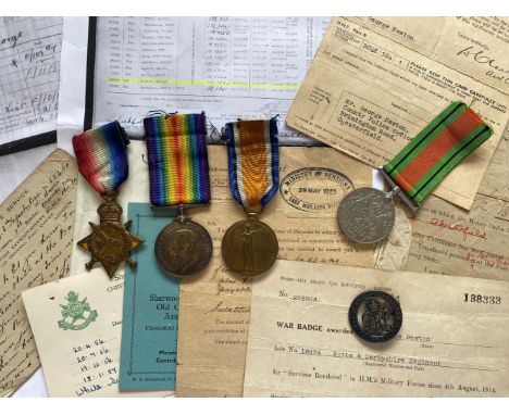 A GROUP OF FOUR AND SILVER WAR BADGE TO THE SHERWOOD FORESTERS. A Great War Trio comprising 1914-15 Star named to 18454 Pte G