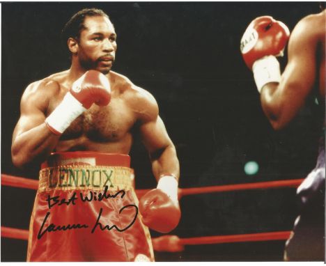 Lennox Lewis signed 10 x8 colour boxing action photo. Good Condition. All autographs are genuine hand signed and come with a 