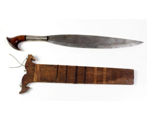 An early 19th Century shaped heavy steel Middle Eastern Short Sword, with silver and shaped wooden handle, the original woode