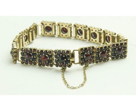 A Ladies gold plated silver Bracelet, of link design with attractive ruby type pyramid shaped garnet reliefs. (1) 