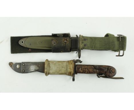 A U.S. Marine Issue Bayonet / Dagger, with black handle and green coloured scabbard; together with a similar camouflage Roman