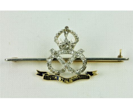 A "South Staffordshire" Military 18ct gold and platinum Infinity Knot Brooch Set, with 36 stone (.54 tcw) with blue enamel. (
