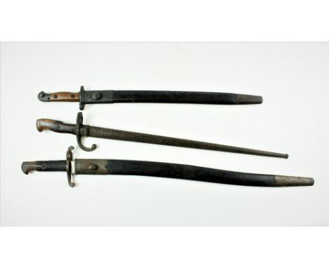 A British c. 1853 Remington Rolling Block Rifle Bayonet, 22 3/4" blades, and original leather scabbard; a French Epee type Ba