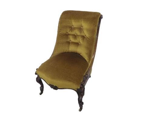 Victorian mahogany nursing chair, the scrolled mahogany supports with button-back mustard upholstery upon carved cabriole fro