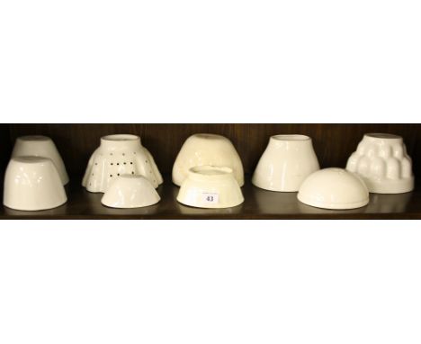 Collection of nine various ceramic jelly moulds, one with pierced decoration (9)