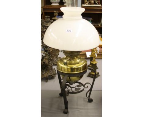 Brass oil lamp with glass opaline glass shade and wrought iron stand, 27" high