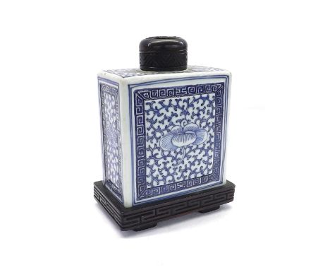 Chinese blue and white tea caddy of rectangular form, decorated overall with flowerheads amidst scrolling foliage and within 