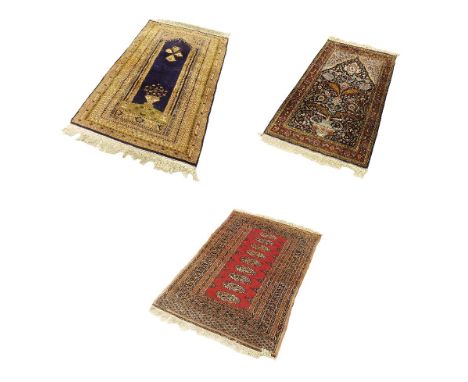 Turkish type floor rug decorated with floral still life and hanging lantern amidst ribbon borders upon a blue ground, 61" x 3