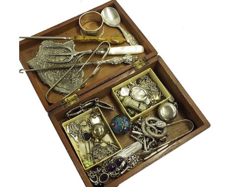 Mahogany box containing an assortment of silver, white metal and plated objects including paperclip, button hooks, napkin rin