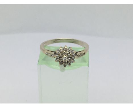 A ladies 9ct white gold diamond cluster ring, approx.20ct, approx 2.1g and approx size N.