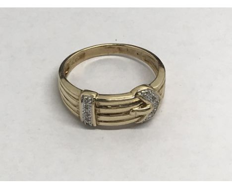 A gents 9ct gold buckle ring set with diamonds, approx 4g and approx size V.