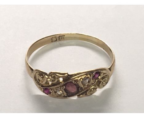 An 18carat gold ring set with RubyÕs and chip stone diamonds. Ring size S.