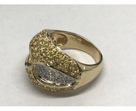 A ladies 14ct gold diamond and topaz dress ring, approx 11.3g and approx size N-O.