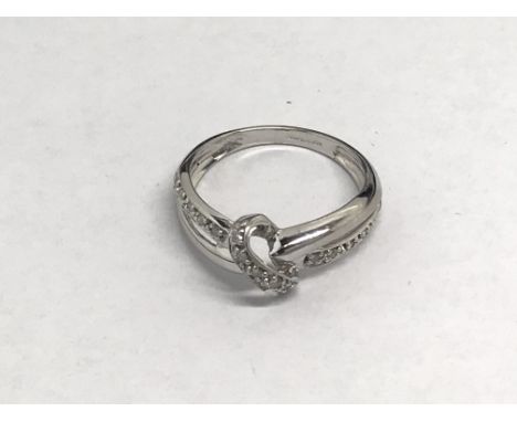 A ladies 9ct white gold ring set with diamonds, approx 1.8g and approx size J-K.