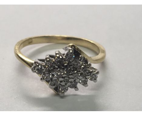 An 18carat gold ring set with a cluster of diamonds ring size H.