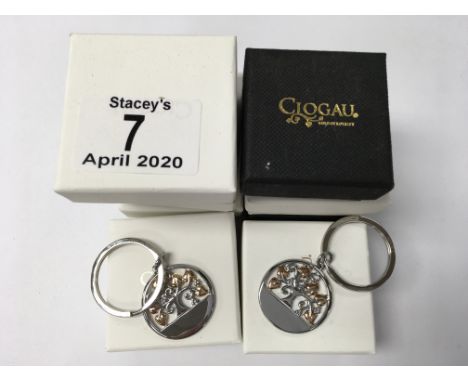 8 identical boxed Clogau key ring pendants.