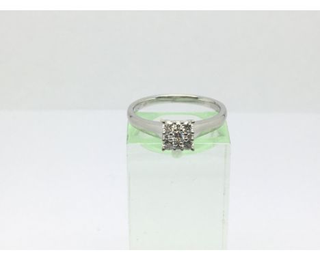 A 9ct white gold nine stone diamond ring, approx .24ct, approx 2.4g and approx size N.