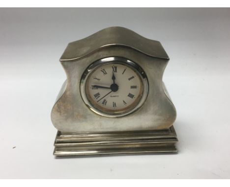 A small silver case mantle clock with quartz movement - NO RESERVE