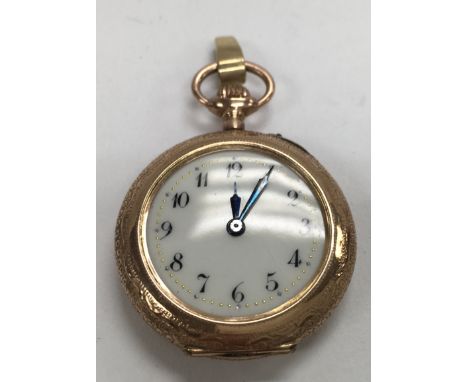 A 14ct Cased rose gold fob watch with Enamel decoration to back cover.