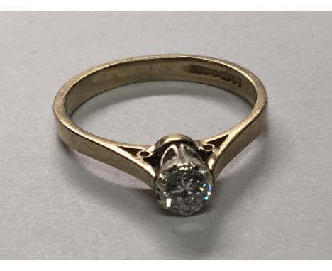 An 18carat gold ring set with a brilliant cut diamond approx 0.25 of a carat. Ring size N.