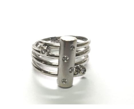 A modern design white gold ring set with diamonds 0.12 of carat total weight 6.5g ring size K-L