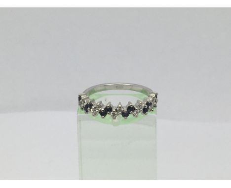 An 18ct white gold ring set with 12 small sapphires and 10 small diamonds, approx 2.2g and approx size K-L.