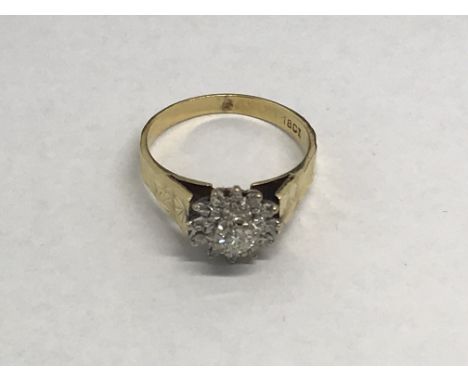 An 18ct gold diamond cluster ring, approx 4.6g and approx size P.