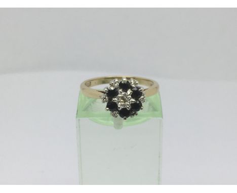 A 9ct white gold sapphire and diamond cluster ring, approx 2.7g and approx size L-M.