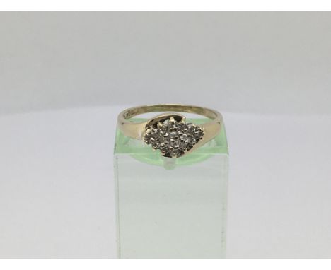 A 9ct gold 16 stone diamond cluster ring, approx 0.15ct, approx 2.4g and approx size M.