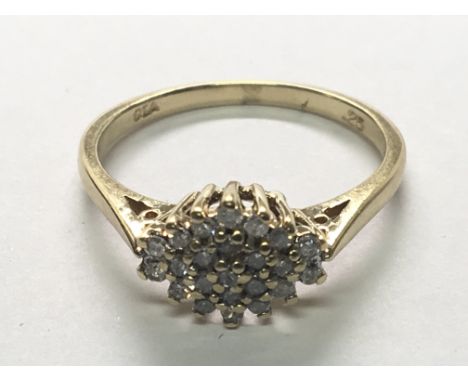 A 9carat gold ring set with a pattern of diamonds. ring size O.