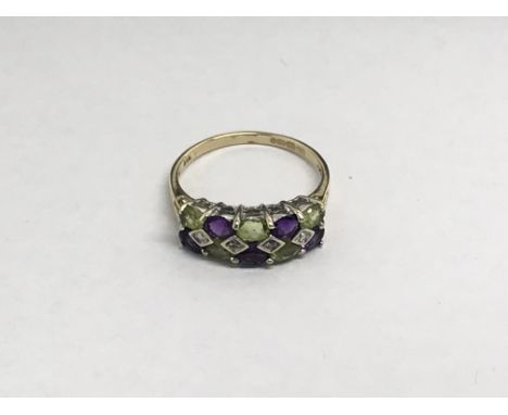 A ladies 9ct gold multi stone ring set with peridot, amethyst and small diamonds, approx 2.5g and approx size P-Q.